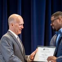 Dr. Potteiger (left) giving Deon Atkins (right) his award.